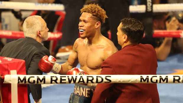 Devin Haney celebrates his victory over Vasyl Lomachenko.
